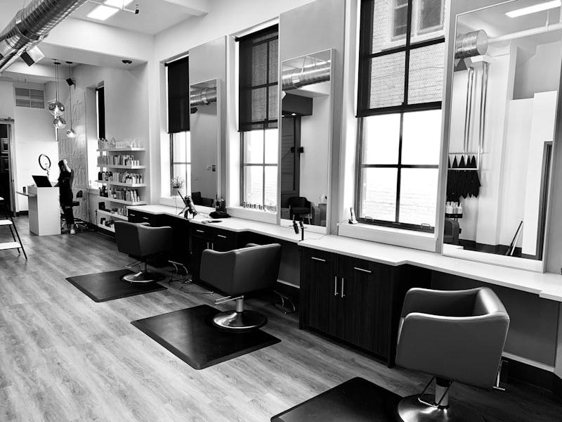 Stylish hair salon interior with mirrors and styling chairs in Montreal