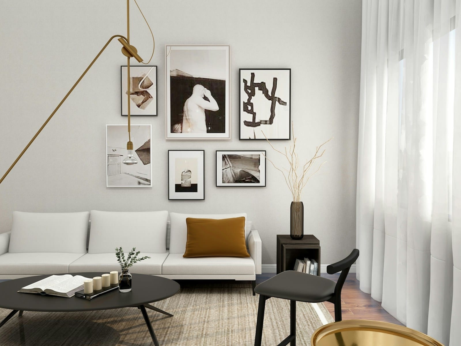 A living room with a white sofa and framed art on the wall