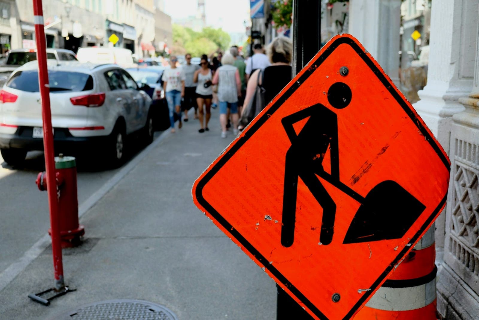 a sign on a sidewalk